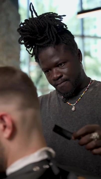 Barber finishing a fade at Casa