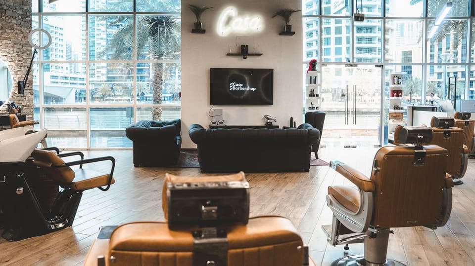 Waiting lounge with the Casa neon sign and a view of the Marina