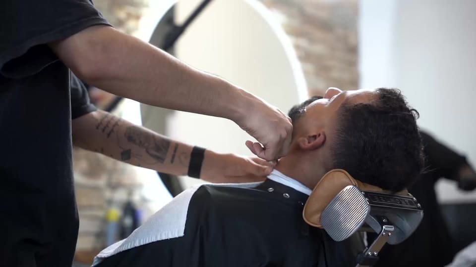 Beard line-up with the client reclined in the chair